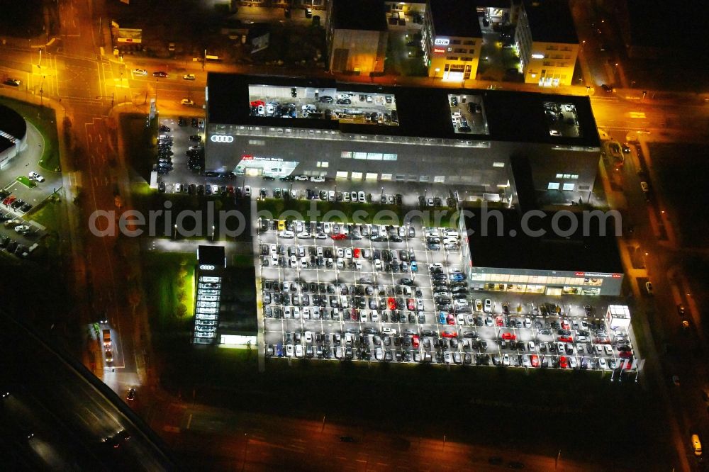 Berlin at night from above - Night lighting Car dealership building Audi Zentrum Adlershof on Rudower Strasse in the district Adlershof in Berlin, Germany