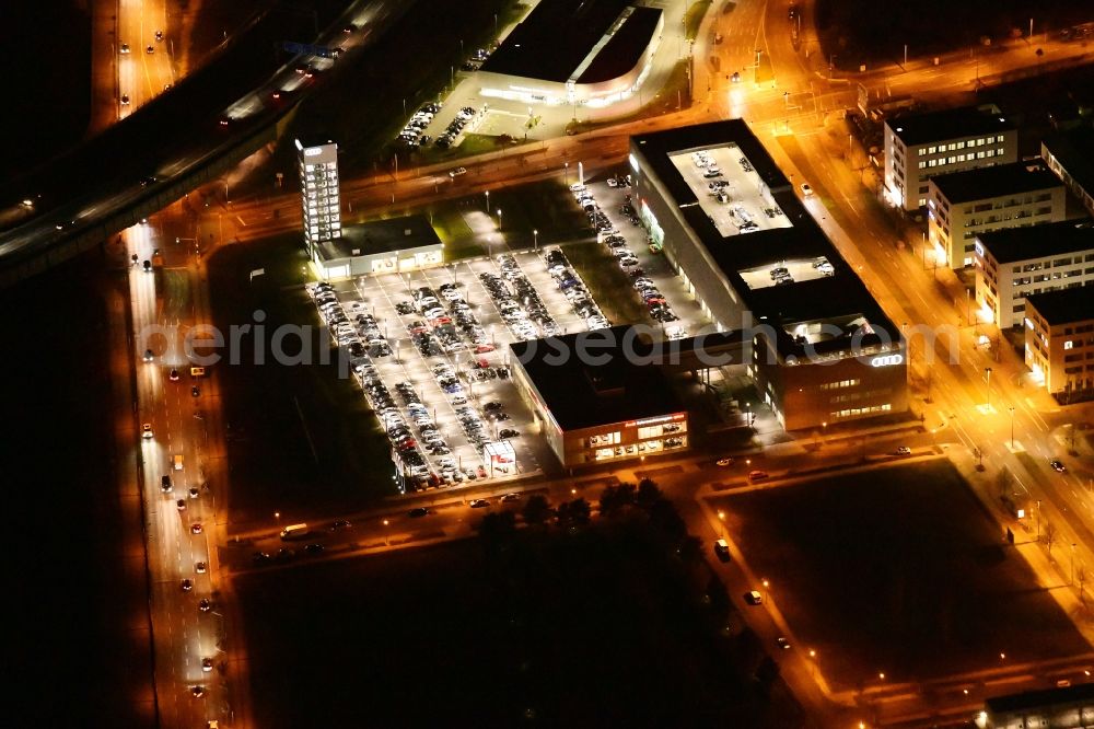 Aerial image at night Berlin - Night lighting Car dealership building Audi Zentrum Adlershof on Rudower Strasse in the district Adlershof in Berlin, Germany