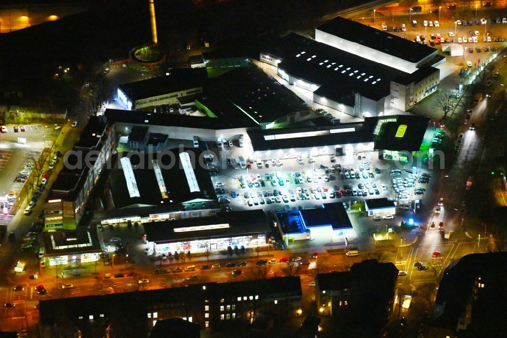 Aerial photograph at night Berlin - Night lighting Car dealership building Audi Zentrum Berlin Tegel in the district Reinickendorf in Berlin, Germany