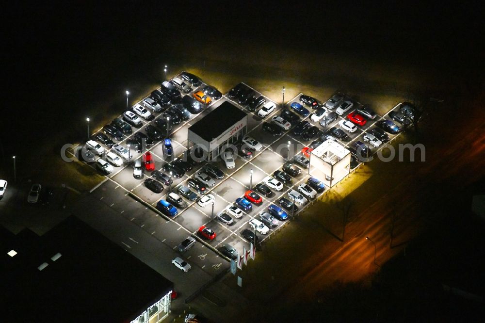 Aerial image at night Fürstenwalde/Spree - Night lighting Car dealership building Audi Zentrum Fuerstenwalde on Langewahler Strasse in Fuerstenwalde/Spree in the state Brandenburg, Germany