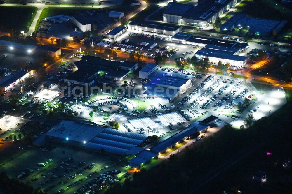 Hoppegarten at night from above - Night lighting car dealership building Automobile BCA Autoauktionen GmbH and DUeRKOP GmbH Neuer Hoenower Weg in Hoppegarten in the state Brandenburg