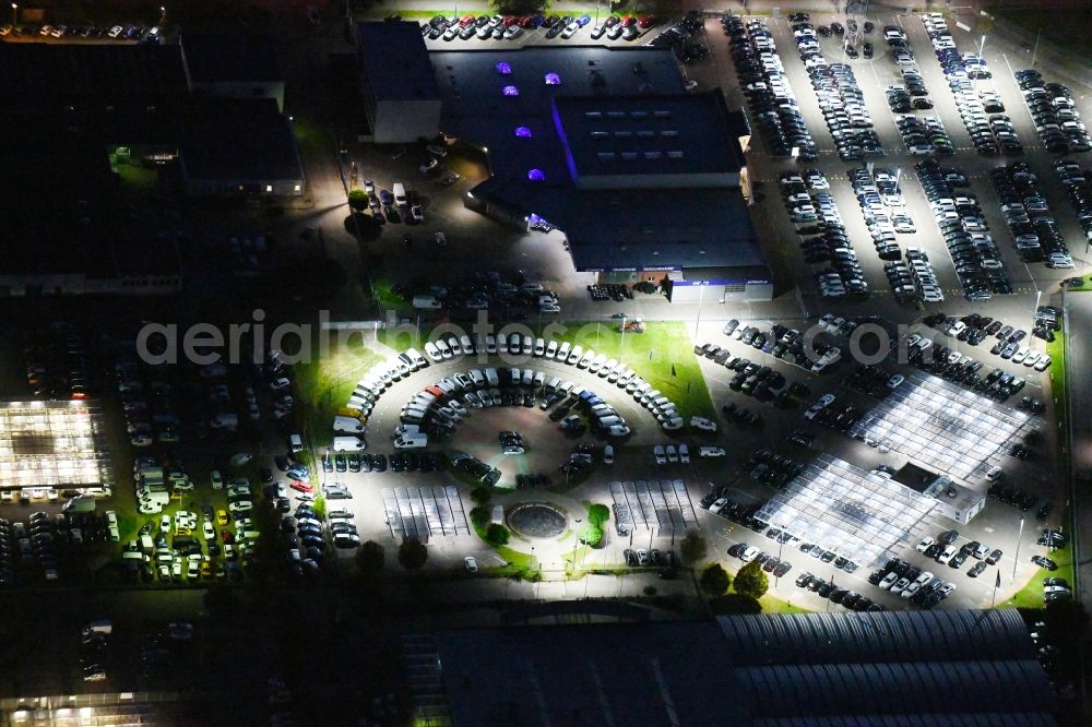 Hoppegarten at night from above - Night lighting car dealership building Automobile BCA Autoauktionen GmbH and DUeRKOP GmbH Neuer Hoenower Weg in Hoppegarten in the state Brandenburg