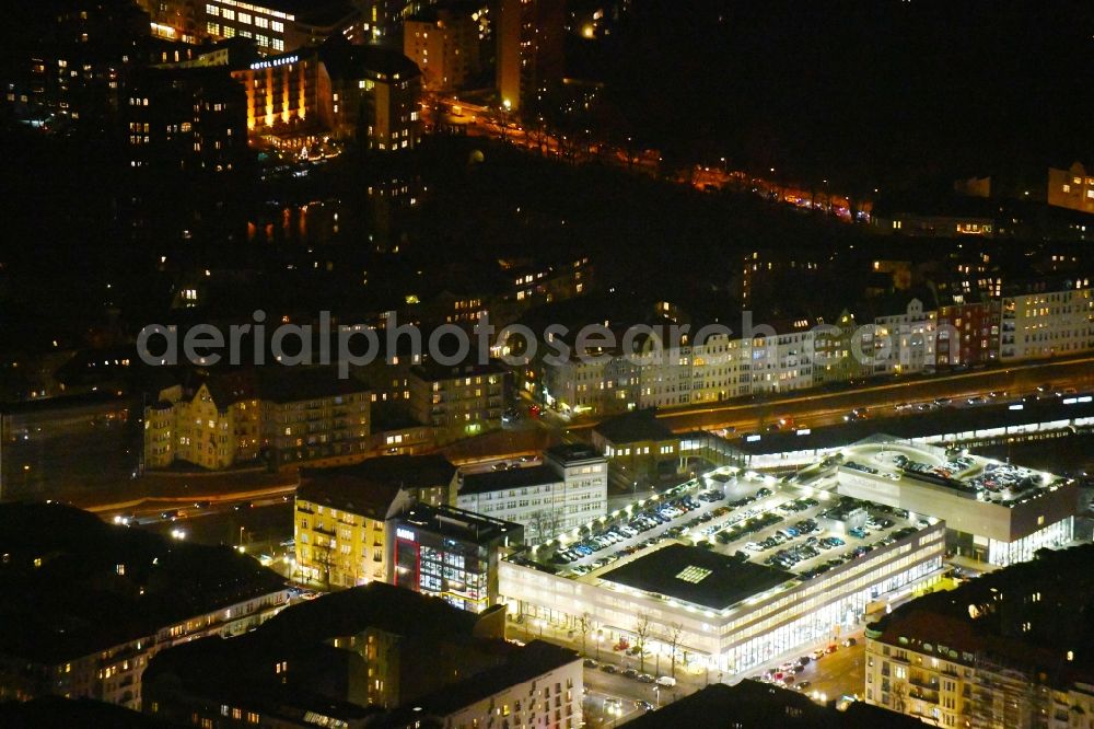 Aerial photograph at night Berlin - Night lighting Car dealership building BMW Niederlassung Berlin Kaiserdamm in the district Westend in Berlin, Germany