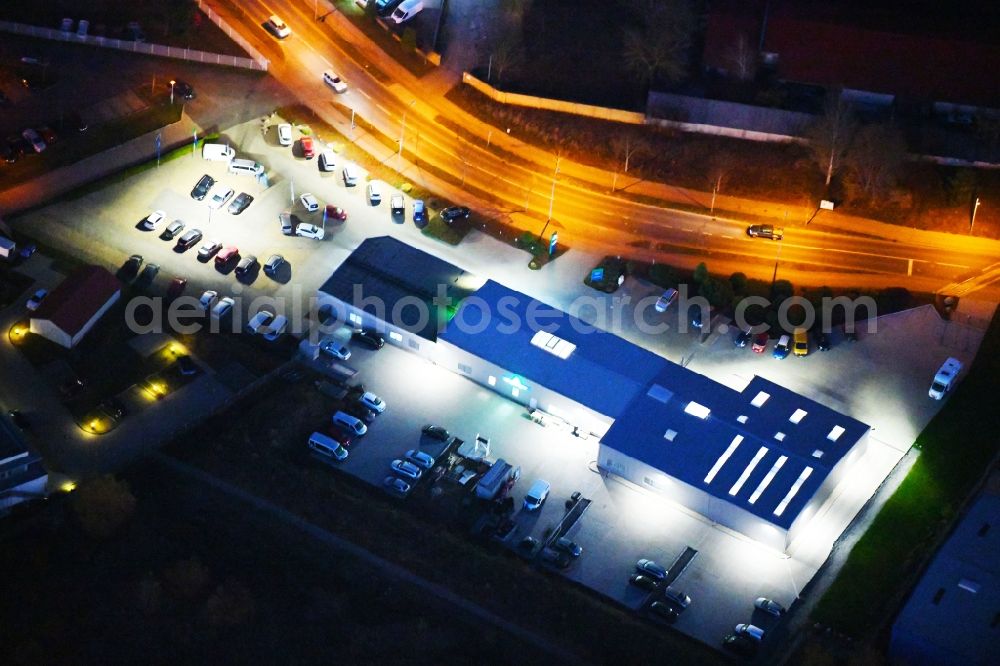 Strausberg at night from above - Night lighting Car dealership building Autohaus Marko Zabel GmbH&Co.KG in Strausberg in the state Brandenburg, Germany