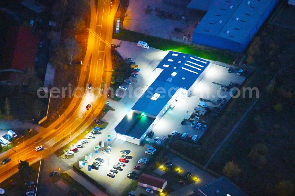 Aerial image at night Strausberg - Night lighting Car dealership building Autohaus Marko Zabel GmbH&Co.KG in Strausberg in the state Brandenburg, Germany