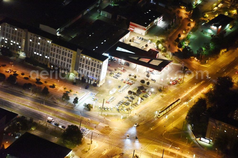 Aerial image at night Berlin - Night view car dealership building M.C.F. Motor Company Fahrzeugvertriebsgesellschaft mbH an der Allee der Kosmonauten in Berlin