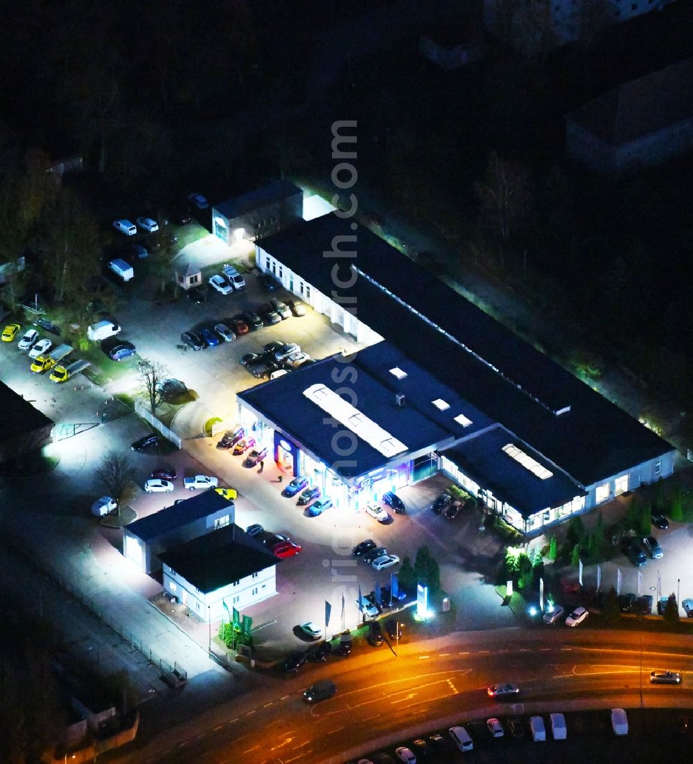 Aerial photograph at night Strausberg - Night lighting Car dealership building Mueller GmbH & Co. KG in Strausberg in the state Brandenburg, Germany