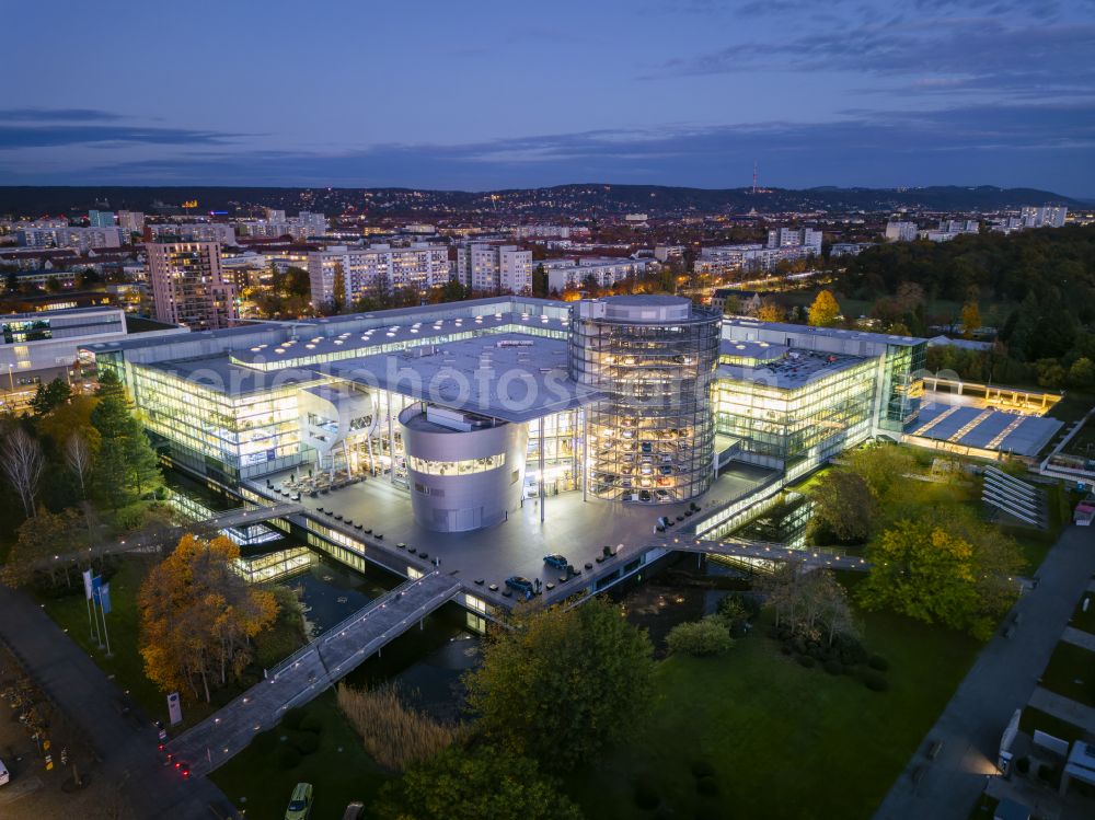 Dresden at night from above - Night lighting car dealership building Glaeserne Manufaktur on street Lennestrasse in Dresden in the state Saxony, Germany