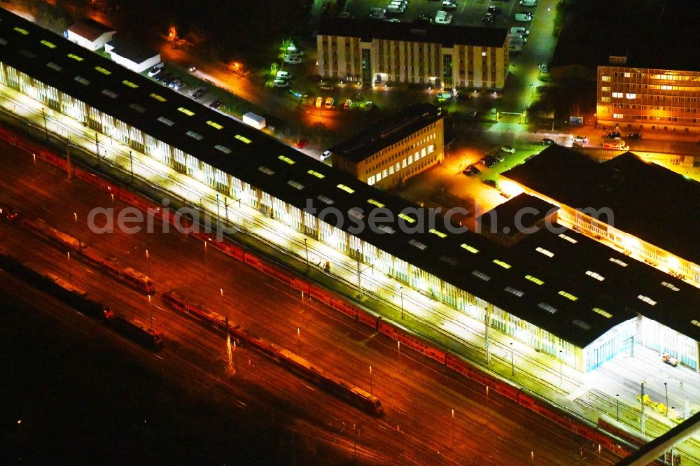 Berlin at night from the bird perspective: Night lighting Railway depot and repair shop for maintenance and repair of trains of passenger transport of the series of S-Bahn Berlin GmbH in the district Lichtenberg in Berlin, Germany