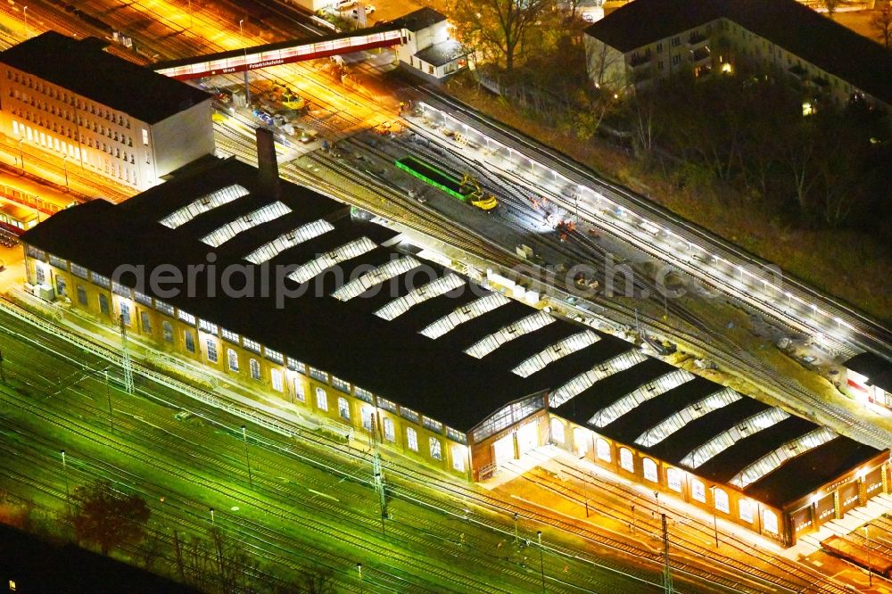 Berlin at night from above - Night lighting Railway depot and repair shop for maintenance and repair of trains of passenger transport of the series of S-Bahn Berlin GmbH in the district Lichtenberg in Berlin, Germany