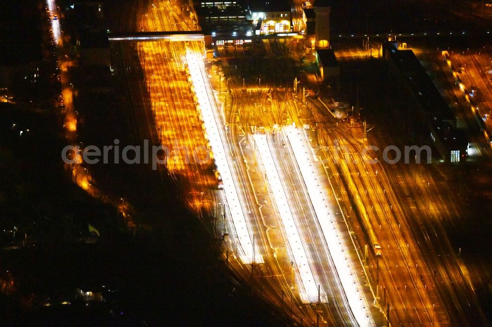 Aerial photograph at night Berlin - Night lighting Railway depot and repair shop for maintenance and repair of trains of passenger transport of the series of S-Bahn Berlin GmbH in the district Lichtenberg in Berlin, Germany