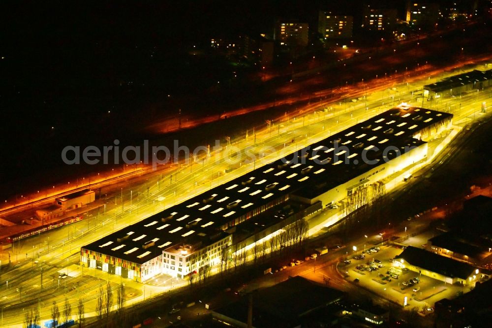 Köln at night from above - Night lighting railway depot and repair shop for maintenance and repair of trains of passenger transport of the series ICE factory in the district Bilderstoeckchen in Cologne in the state North Rhine-Westphalia, Germany