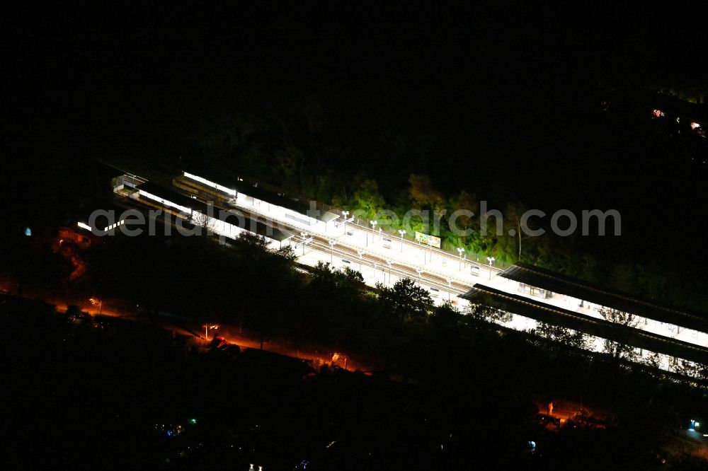 Berlin at night from above - Night lighting station building and track systems of the S-Bahn station on street Priesterweg in the district Schoeneberg in Berlin, Germany