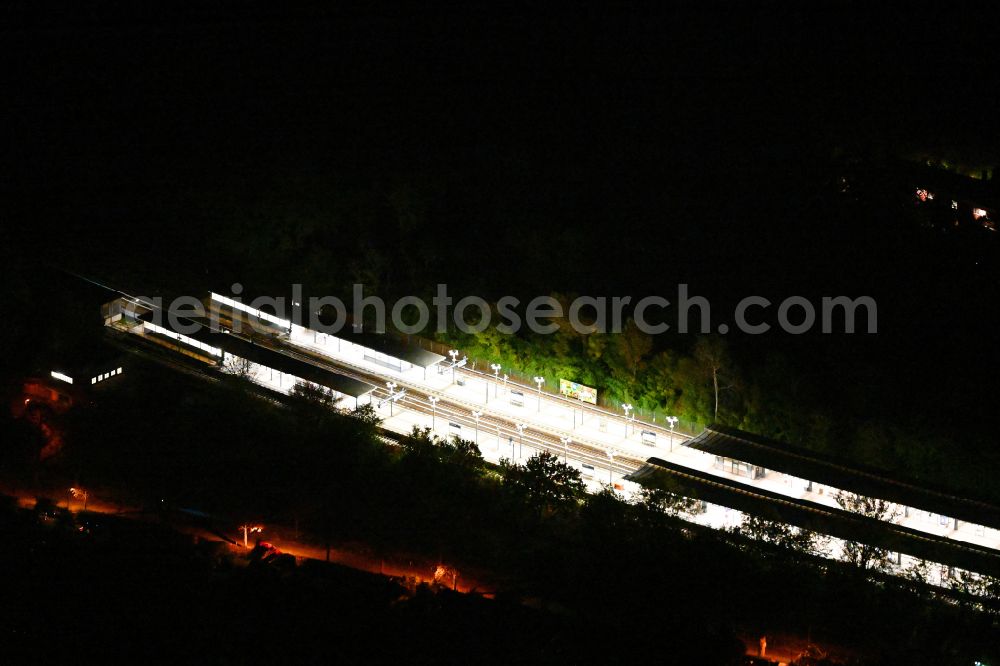 Berlin at night from the bird perspective: Night lighting station building and track systems of the S-Bahn station on street Priesterweg in the district Schoeneberg in Berlin, Germany