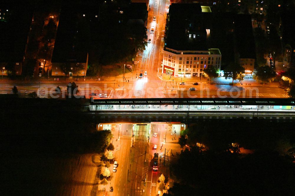 Aerial image at night Berlin - Night lighting station building and track systems of the S-Bahn station Adlershof on street Rudower Chaussee in the district Adlershof in Berlin, Germany