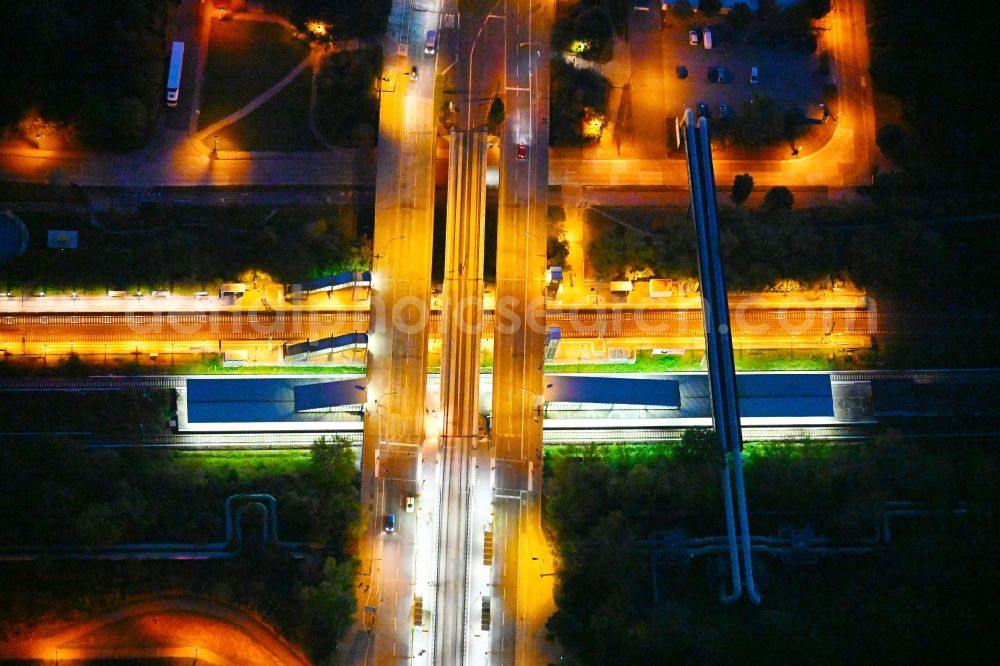 Berlin at night from above - Night lighting station building and track systems of the S-Bahn station on bridge street Falkenberger Chaussee in the district Hohenschoenhausen in Berlin, Germany