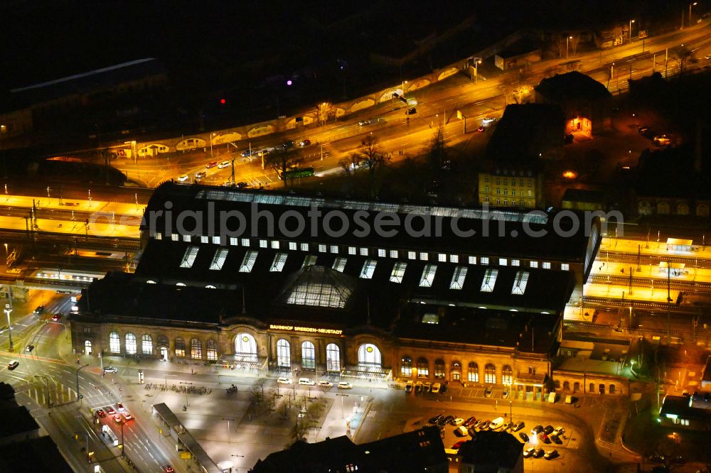 Aerial image at night Dresden - Night lighting station building and track systems of the S-Bahn station Dresden-Neustadt on place Schlesischer Platz in the district Neustadt in Dresden in the state Saxony, Germany