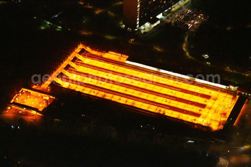 Berlin at night from above - Night lighting Station building and track systems of the S-Bahn station on Flatowallee in the district Charlottenburg in Berlin, Germany