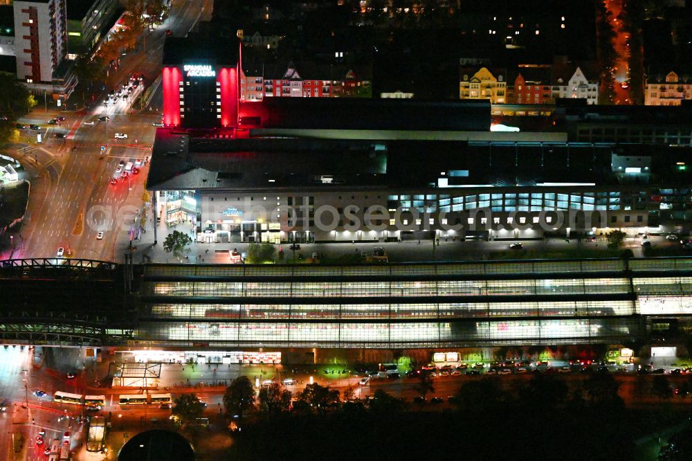 Berlin at night from the bird perspective: Night lighting station building and track systems of the S-Bahn station in the district Spandau in Berlin, Germany