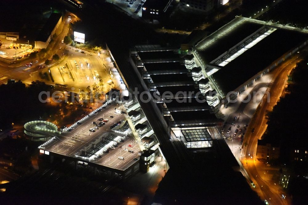 Aerial photograph at night Berlin - Night view station building and track systems of the S-Bahn station Suedkreuz in Berlin