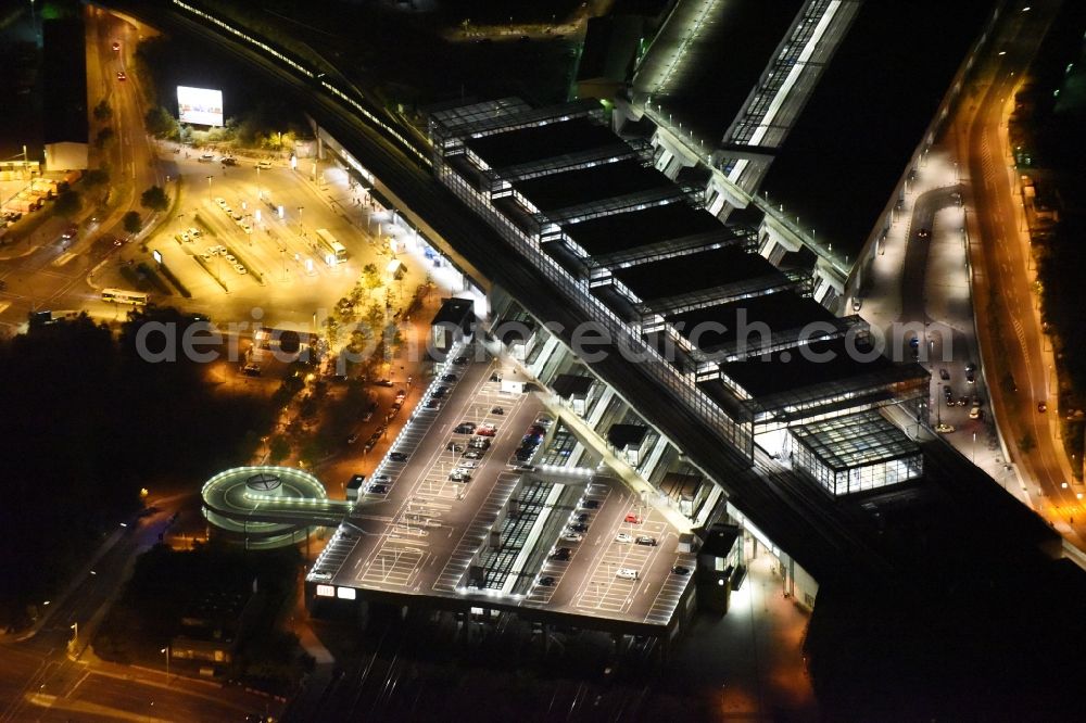 Berlin at night from above - Night view station building and track systems of the S-Bahn station Suedkreuz in Berlin