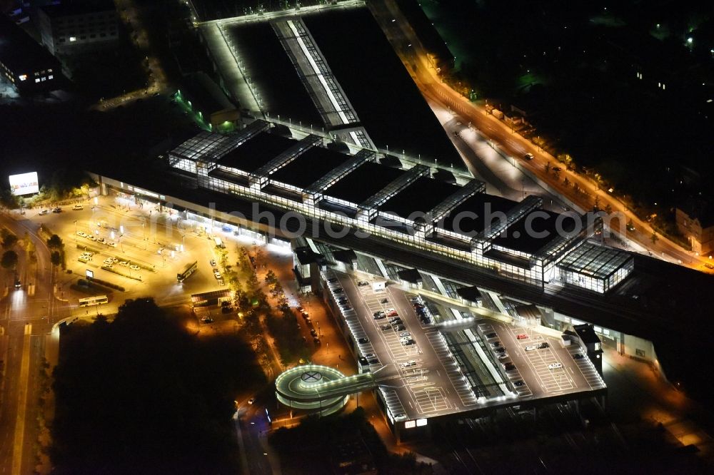 Aerial photograph at night Berlin - Night view station building and track systems of the S-Bahn station Suedkreuz in Berlin