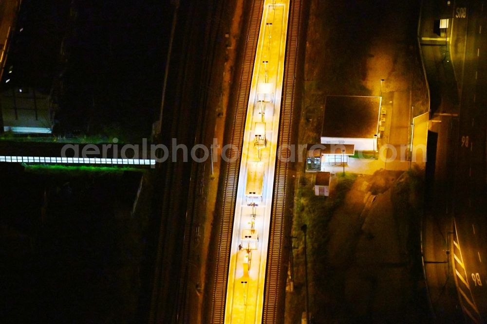 Aerial image at night Leipzig - Night lighting Station building and track systems of the S-Bahn station in the district Wahren in Leipzig in the state Saxony, Germany