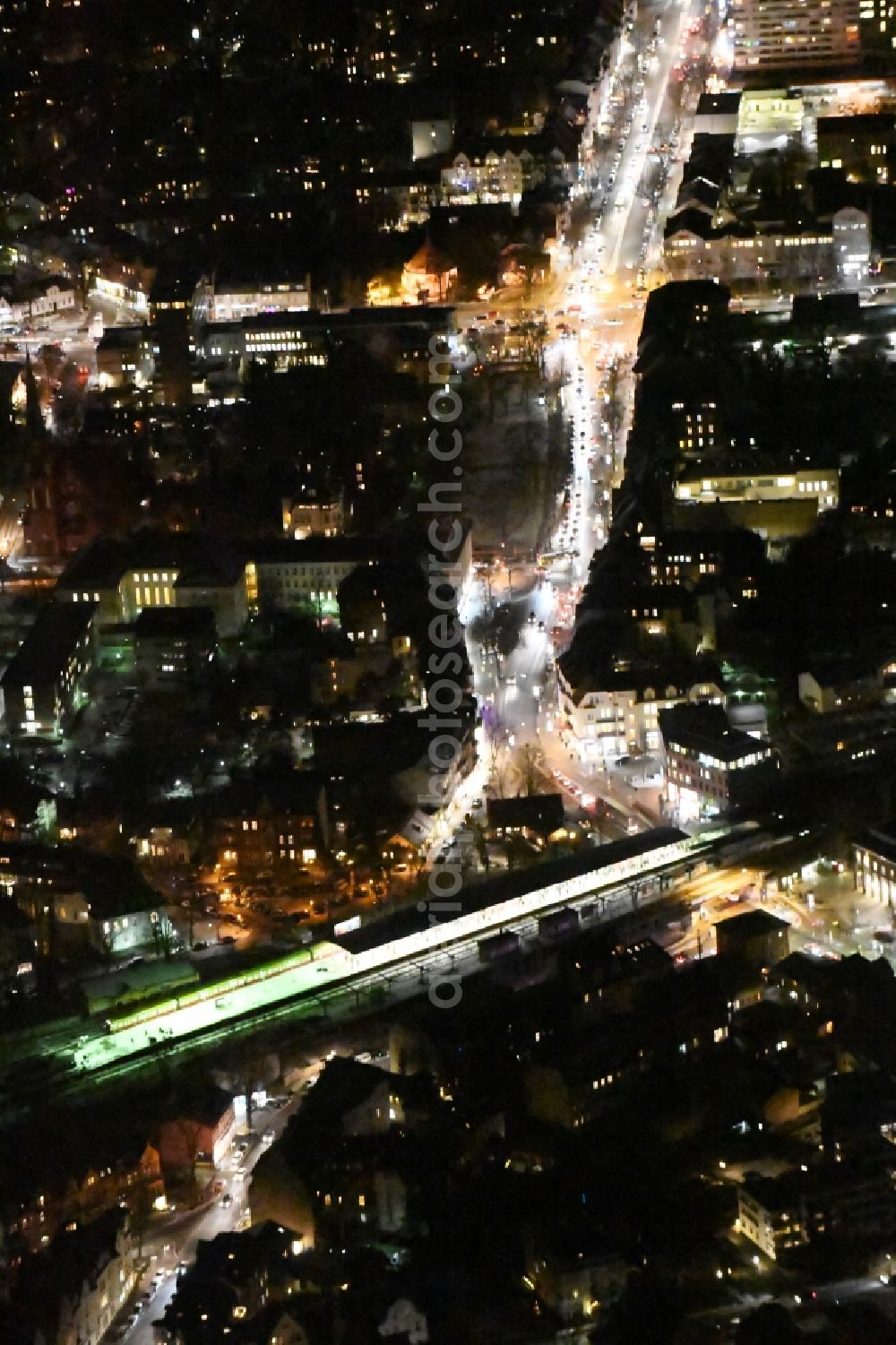 Berlin at night from the bird perspective: Night view station building and track systems of the S-Bahn station Zehlendorf on Teltower Damm in the district Bezirk Steglitz-Zehlendorf in Berlin