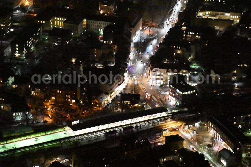 Aerial image at night Berlin - Night view station building and track systems of the S-Bahn station Zehlendorf on Teltower Damm in the district Bezirk Steglitz-Zehlendorf in Berlin