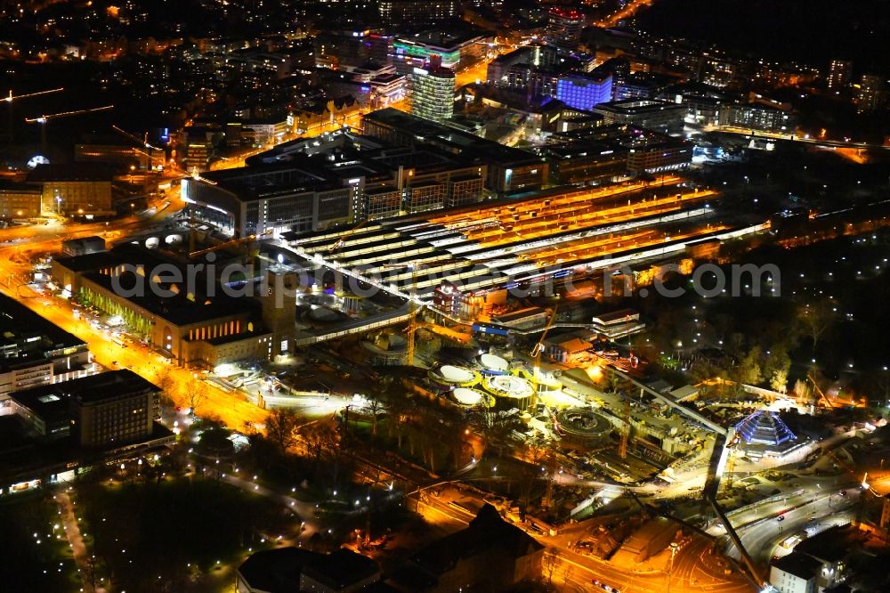 Aerial image at night Stuttgart - Night lighting building of the main station of the railway and construction site for the development project Stuttgart 21 in Stuttgart in the state of Baden-Wurttemberg