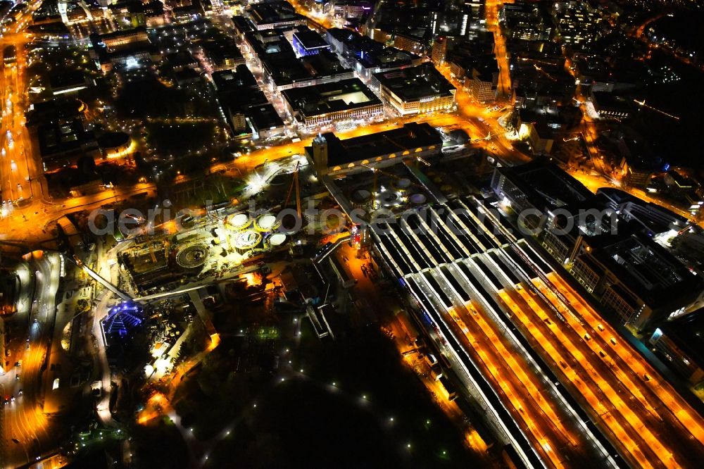 Aerial image at night Stuttgart - Night lighting building of the main station of the railway and construction site for the development project Stuttgart 21 in Stuttgart in the state of Baden-Wurttemberg