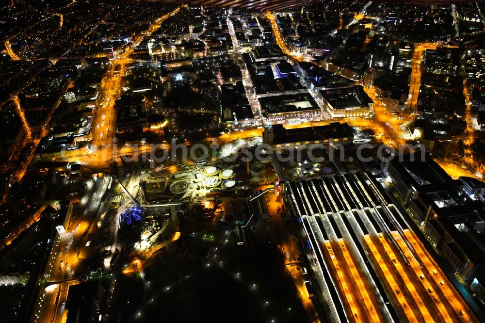 Stuttgart at night from above - Night lighting building of the main station of the railway and construction site for the development project Stuttgart 21 in Stuttgart in the state of Baden-Wurttemberg