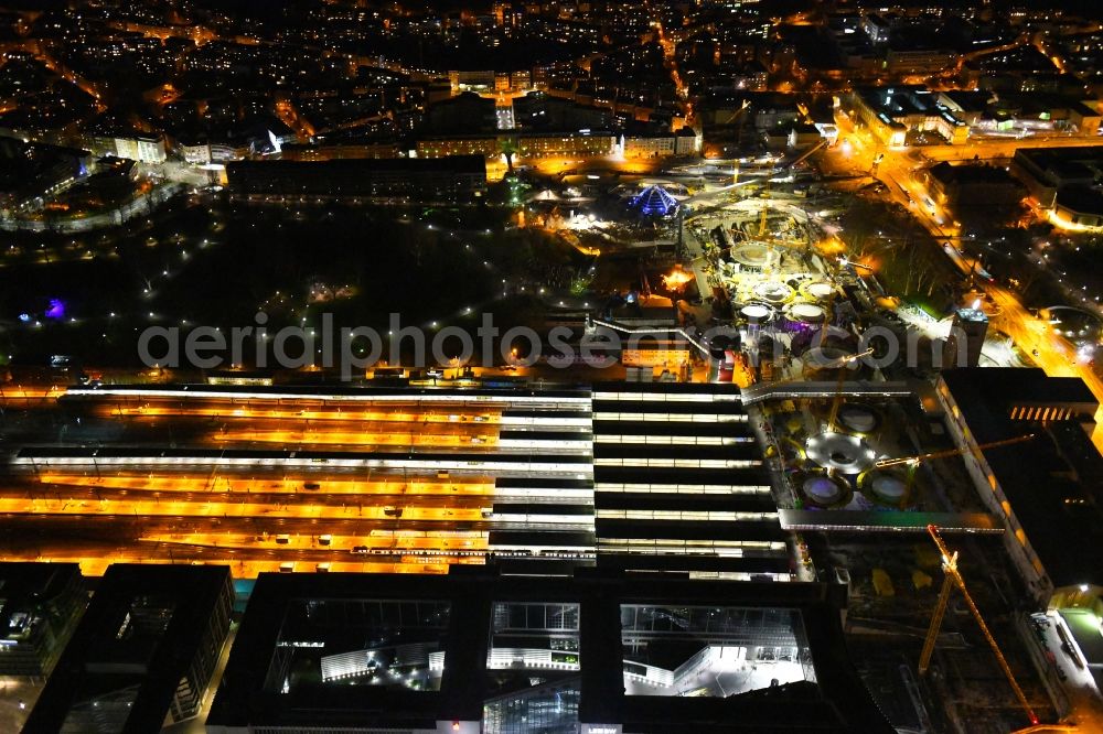 Aerial image at night Stuttgart - Night lighting building of the main station of the railway and construction site for the development project Stuttgart 21 in Stuttgart in the state of Baden-Wurttemberg