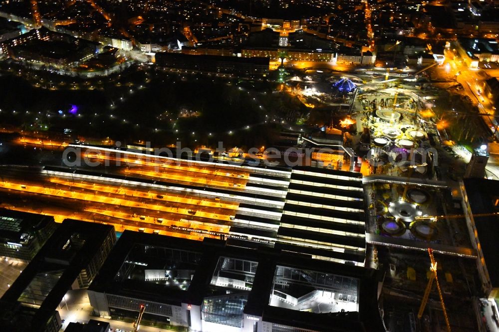 Stuttgart at night from above - Night lighting building of the main station of the railway and construction site for the development project Stuttgart 21 in Stuttgart in the state of Baden-Wurttemberg