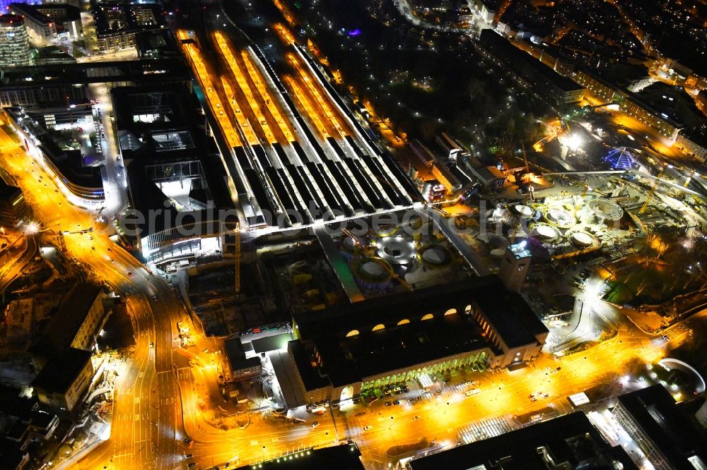 Aerial image at night Stuttgart - Night lighting building of the main station of the railway and construction site for the development project Stuttgart 21 in Stuttgart in the state of Baden-Wurttemberg