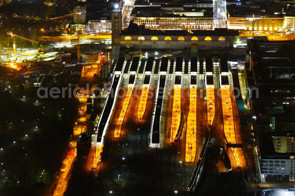 Aerial image at night Stuttgart - Night lighting building of the main station of the railway and construction site for the development project Stuttgart 21 in Stuttgart in the state of Baden-Wurttemberg