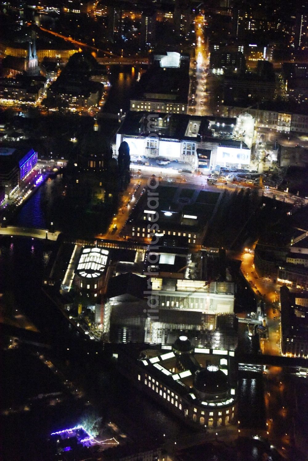 Berlin at night from above - Nught view Museum Island with the Bode Museum, the Pergamon Museum, the Old National Gallery, the Colonnades and the New Museum. The complex is a World Heritage site by UNESCO