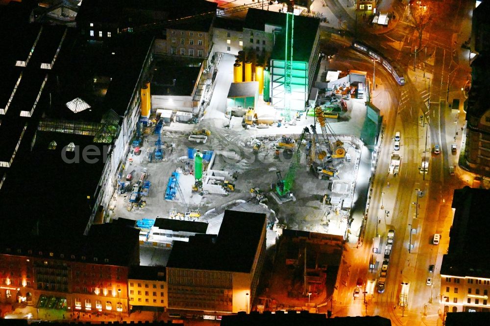 München at night from the bird perspective: Night lighting construction work for the reconstruction of the station building of Central Stationes in the district Ludwigsvorstadt-Isarvorstadt in Munich in the state Bavaria, Germany