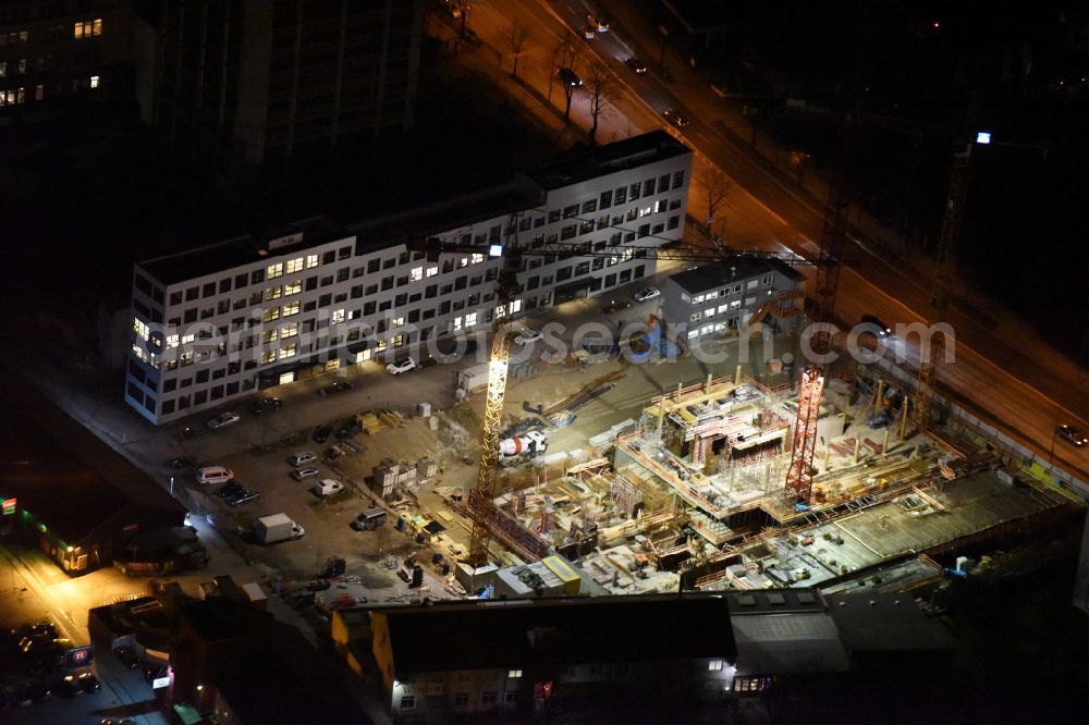 München at night from above - Night lighting construction site of office and corporate management high-rise building HIGHRISE one on street Rosenheimer Strasse in the district Haidhausen in Munich in the state Bavaria, Germany