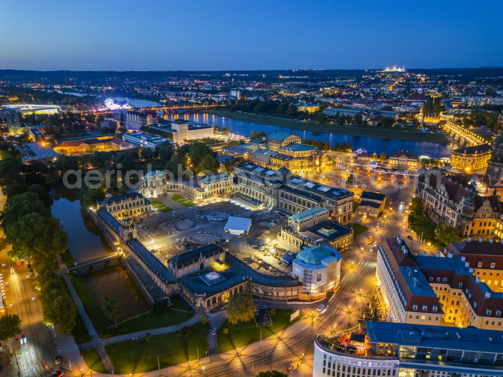 Aerial image at night Dresden - Night lighting construction site with reconstruction and renovation work at the palace of the castle Dresdner Zwinger at Theaterplatz - Sophienstrasse in the district Altstadt in Dresden in the state of Saxony, Germany