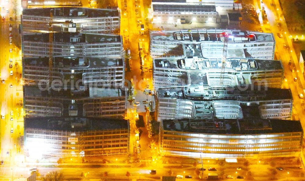 Aerial photograph at night Berlin - Night lighting Construction site to build a new office and commercial building Allianz Campus Berlin in the district Johannisthal - Adlershof in Berlin