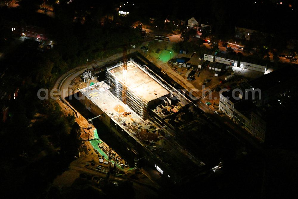 Berlin at night from above - Night lighting construction site for the new building of a research building and office complex Innovations- and Forschungszentrum FUBIC on street Fabeckstrasse in the district Lichterfelde in Berlin, Germany