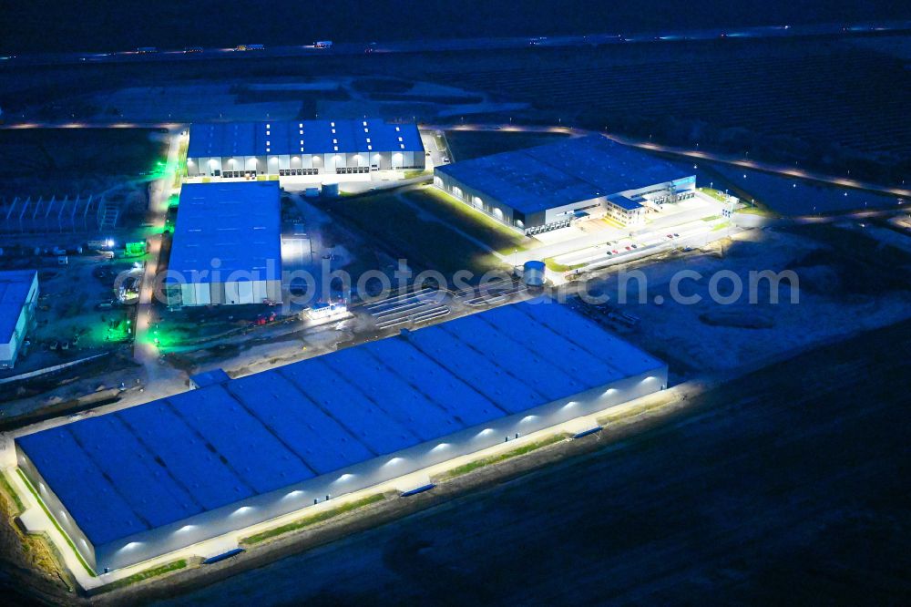 Aerial image at night Vehlefanz - Night lighting construction site to build a new building complex on the site of the logistics center Im Gewerbepark in the district Vehlefanz in Oberkraemer in the state Brandenburg, Germany