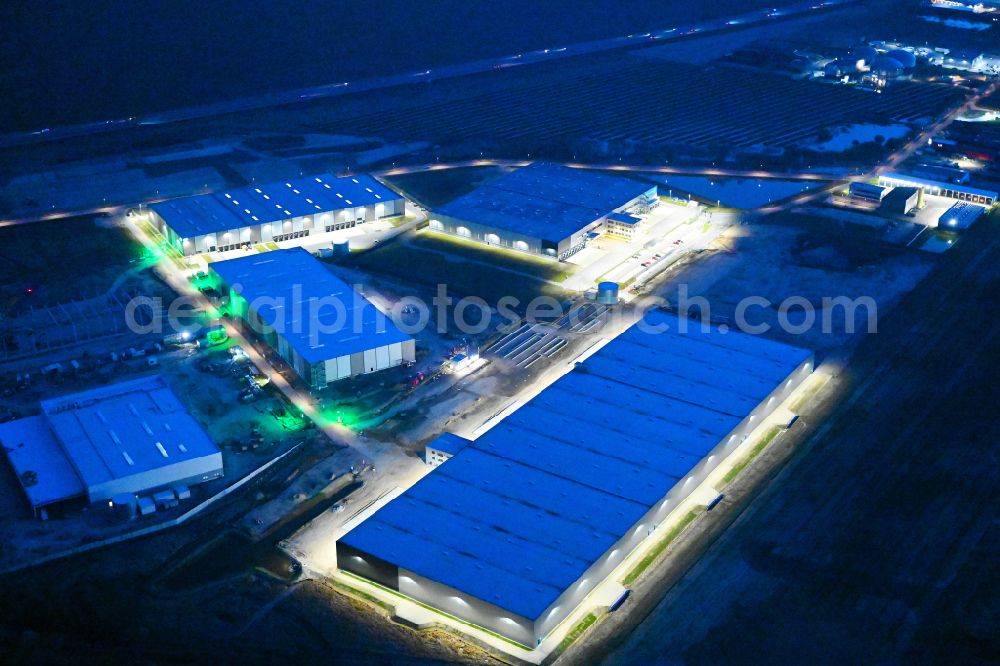 Vehlefanz at night from above - Night lighting construction site to build a new building complex on the site of the logistics center Im Gewerbepark in the district Vehlefanz in Oberkraemer in the state Brandenburg, Germany