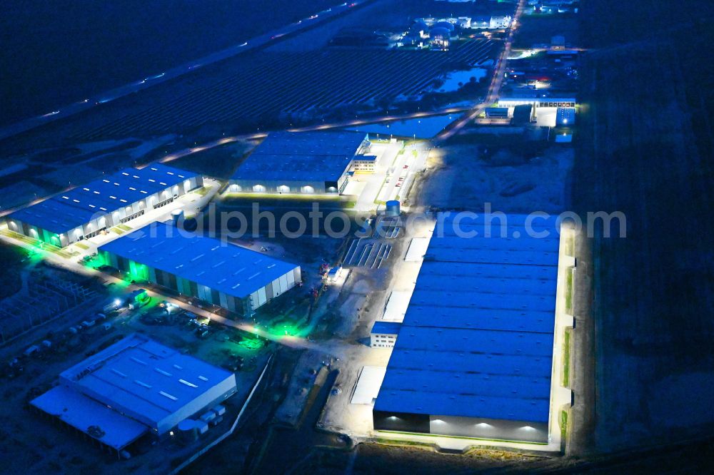 Vehlefanz at night from the bird perspective: Night lighting construction site to build a new building complex on the site of the logistics center Im Gewerbepark in the district Vehlefanz in Oberkraemer in the state Brandenburg, Germany