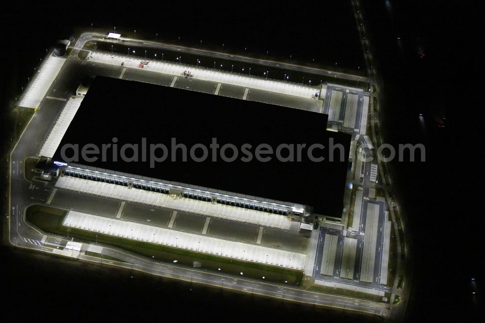 Aerial image at night Kiekebusch - Night lighting construction site for the construction of a logistics center of the Achim Walder retailer Amazon in Kiekebusch in the state of Brandenburg, Germany