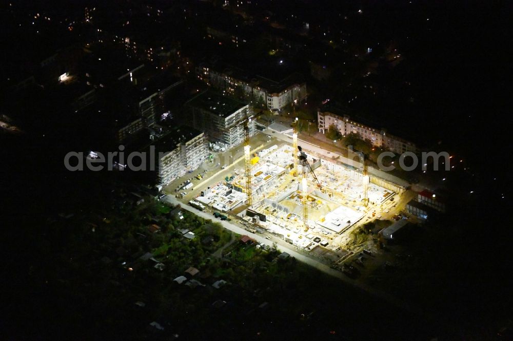 Berlin at night from the bird perspective: Night lighting construction site to build a new multi-family residential complex Maximilians Quartier on Forckenbeckstrasse in the district Schmargendorf in Berlin, Germany