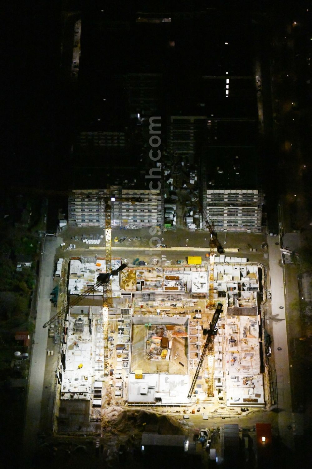 Berlin at night from above - Night lighting construction site to build a new multi-family residential complex Maximilians Quartier on Forckenbeckstrasse in the district Schmargendorf in Berlin, Germany