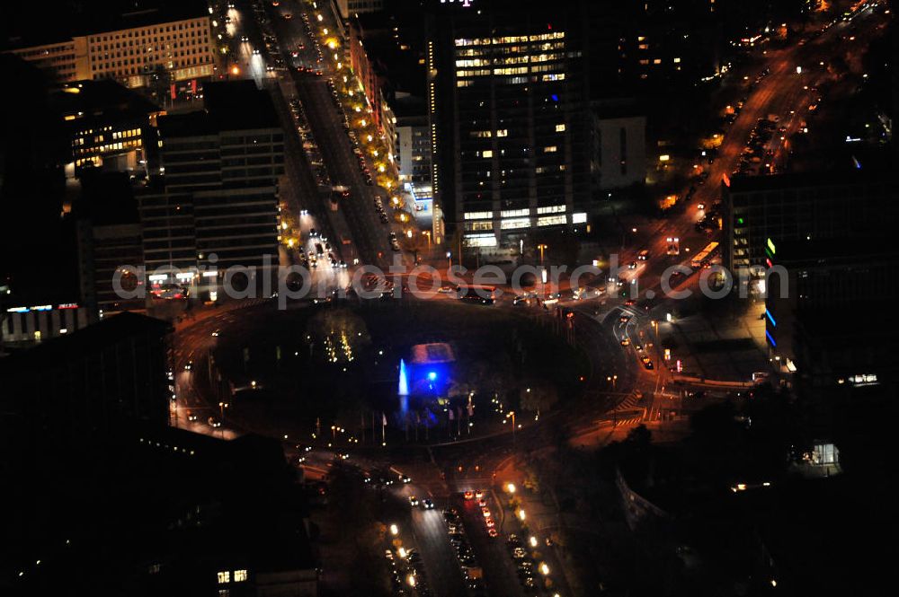 Berlin at night from the bird perspective: Nachtluftbild vom nächtlichen Berlin anläßlich des Festival of Lights in der Berliner Innenstadt. Hunderttausende Besucher strömten am letzten Wochenende des Festivals zu den illuminierten Gebäuden und angestrahlten Bereichen der Innenstadt. Der Ernst-Reuter-Platz im Bezirk Berlin-Charlottenburg gesehen aus der Straße des 17.Juni mit Blick in die Otto-Suhr-Allee und die Bismarckstraße. Das Telefunken-Hochhaus liegt zwischen den beiden Straßen.Nightshot of the square Ernst-Reuter-Platz in Berlin's district Charlottenburg, seen from the street of june 17th. The Telefunken tower is built between the streets Otto-Suhr-Allee and Bismarckstraße.