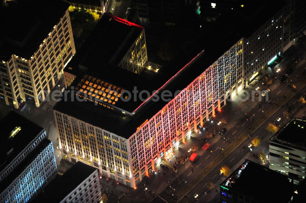 Berlin at night from the bird perspective: Nachtluftbild vom nächtlichen Berlin anläßlich des Festival of Lights in der Berliner Innenstadt. Hunderttausende Besucher strömten am letzten Wochenende des Festivals zu den illuminierten Gebäuden und angestrahlten Bereichen der Innenstadt. Das Berlin Marriott Hotel von der Ebertstraße aus gesehen im Bezirk Berlin-Mitte. Night shot of the illuminatedBerlin Marriott Hotel seen from the street Ebertstrasse.